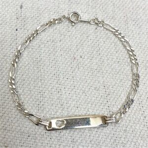 Silver tone Figaro link ID Bracelet with heart cut out